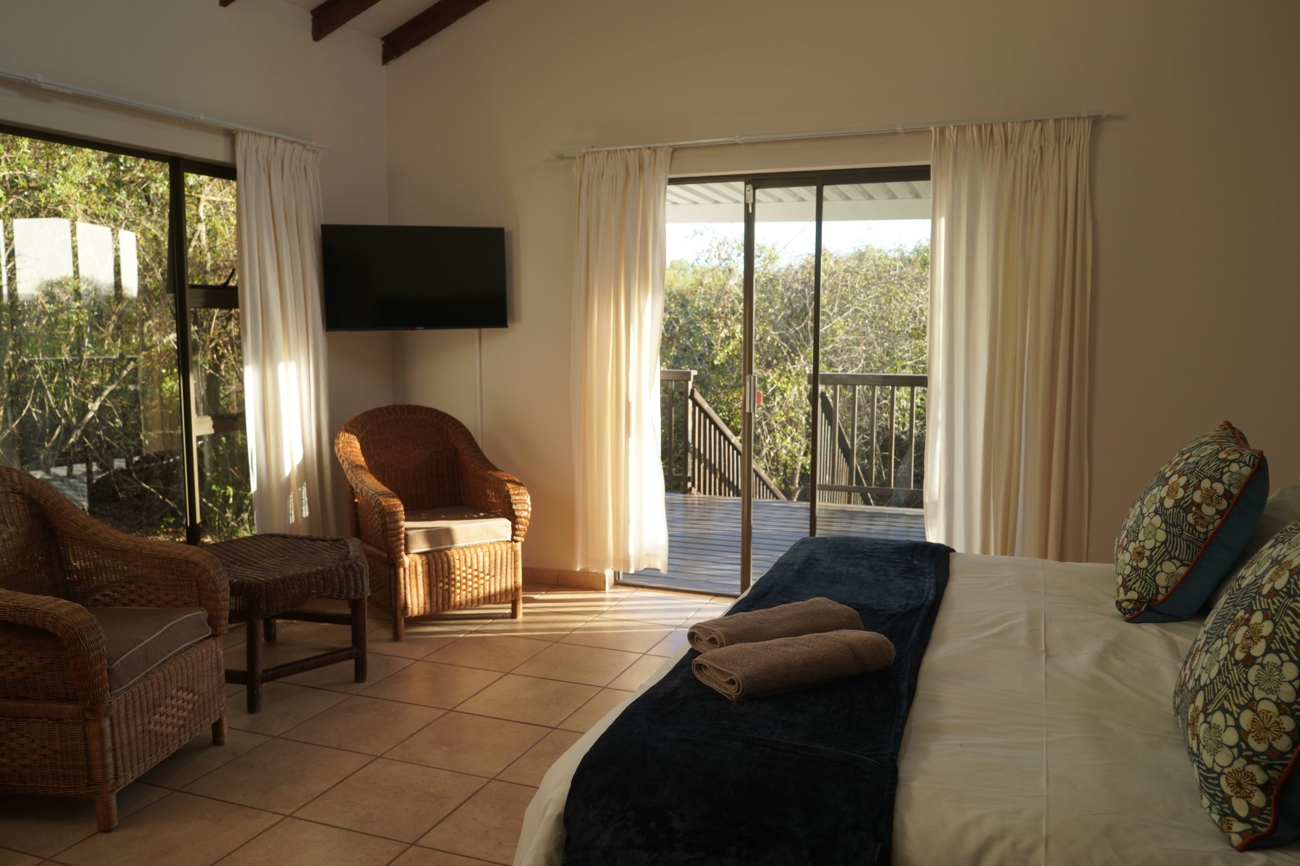 King size bed self-catering bush cottage in sand forest at Mazuri Bush Cottages near Hluhluwe iMfolozi Park